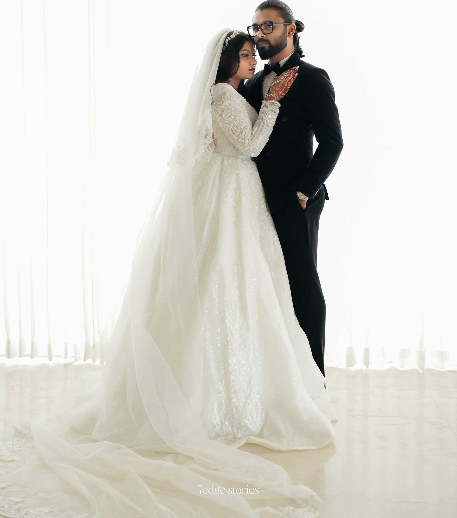 Bride and groom in a bright studio portrait
